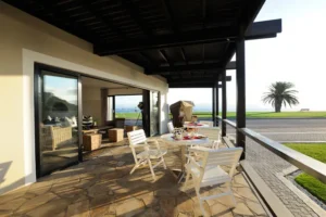 Outdoor tables on the covered lagoon-facing deck