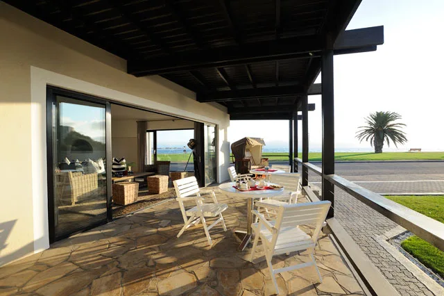 Outdoor tables on the covered lagoon-facing deck