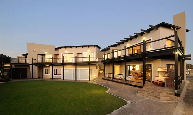 Guesthouse courtyard and two-storey accommodation exterior